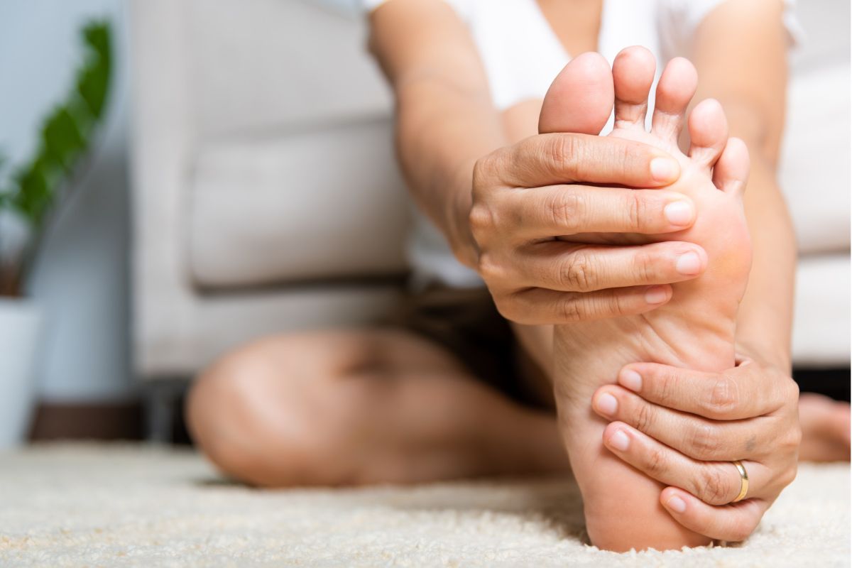 woman touching foot